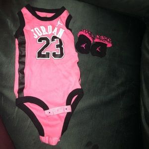 0-6 month pink Jordan onesie with baby booties